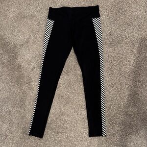 Athleta black leggings with B&W striped side panels XS